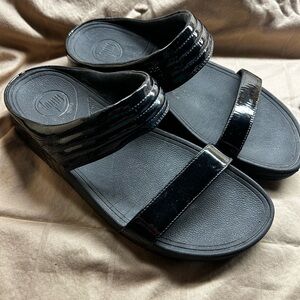 Black patent slides by Fit Flop, size 9